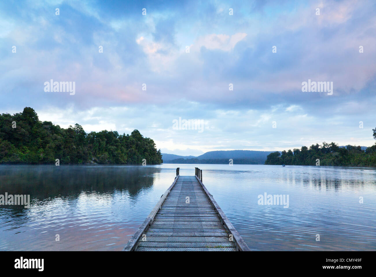 Jetty at Lake Mapourika, on the West Coast of New Zealand's South Island, at dawn. Stock Photo