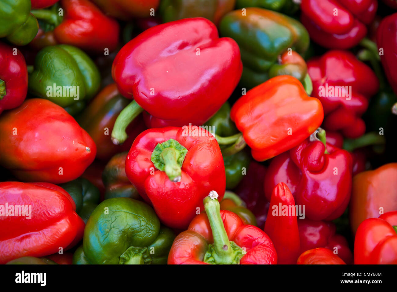 An assortment of red and green bell peppers Stock Photo - Alamy