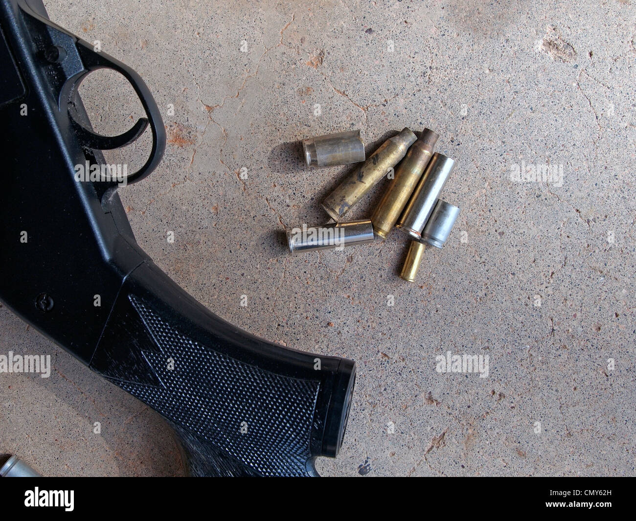 Various calibers of spent rifle shell casings made of brass Stock Photo
