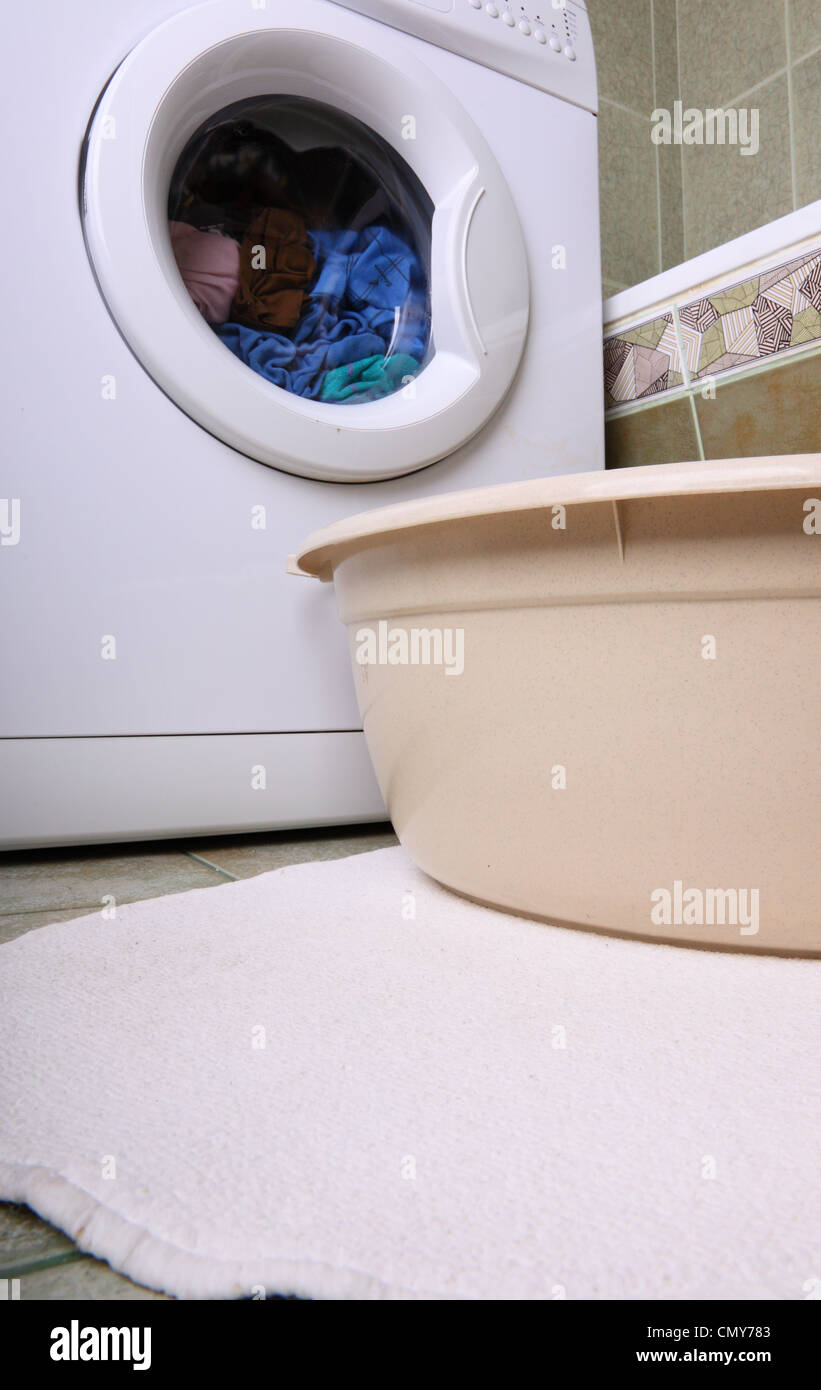towels in washing machine cloths indoor bathroom Stock Photo Alamy