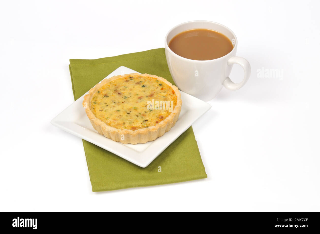 A cooked ham and cheese quiche with a cup of coffee on white background cut out Stock Photo