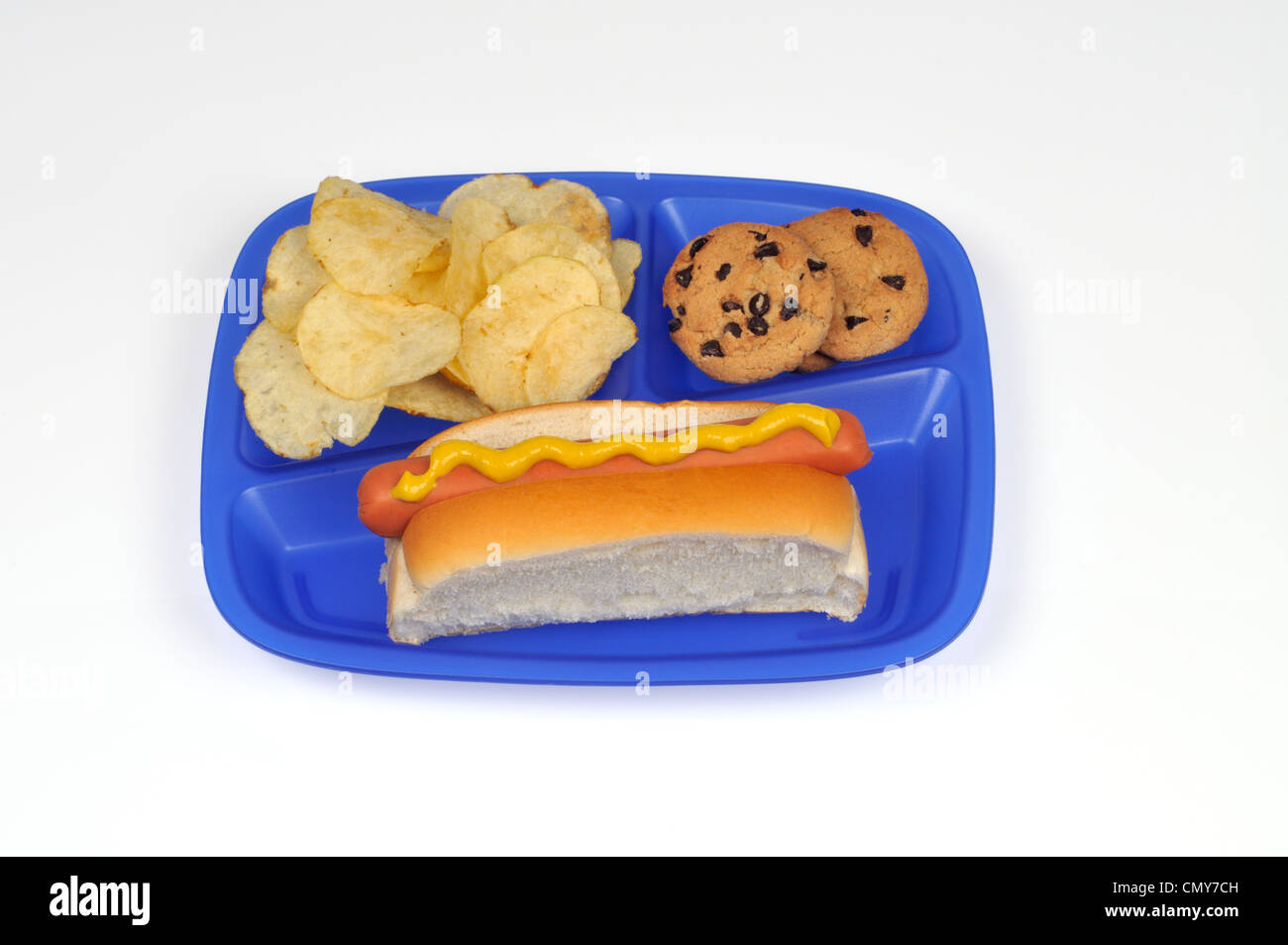 School lunch tray concept with hot dog, potato chips and chocolate chip cookies Stock Photo