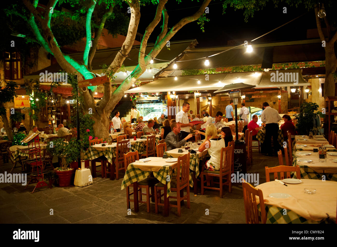 Restaurants in the old medieval city of Rhodes, Greece. Stock Photo