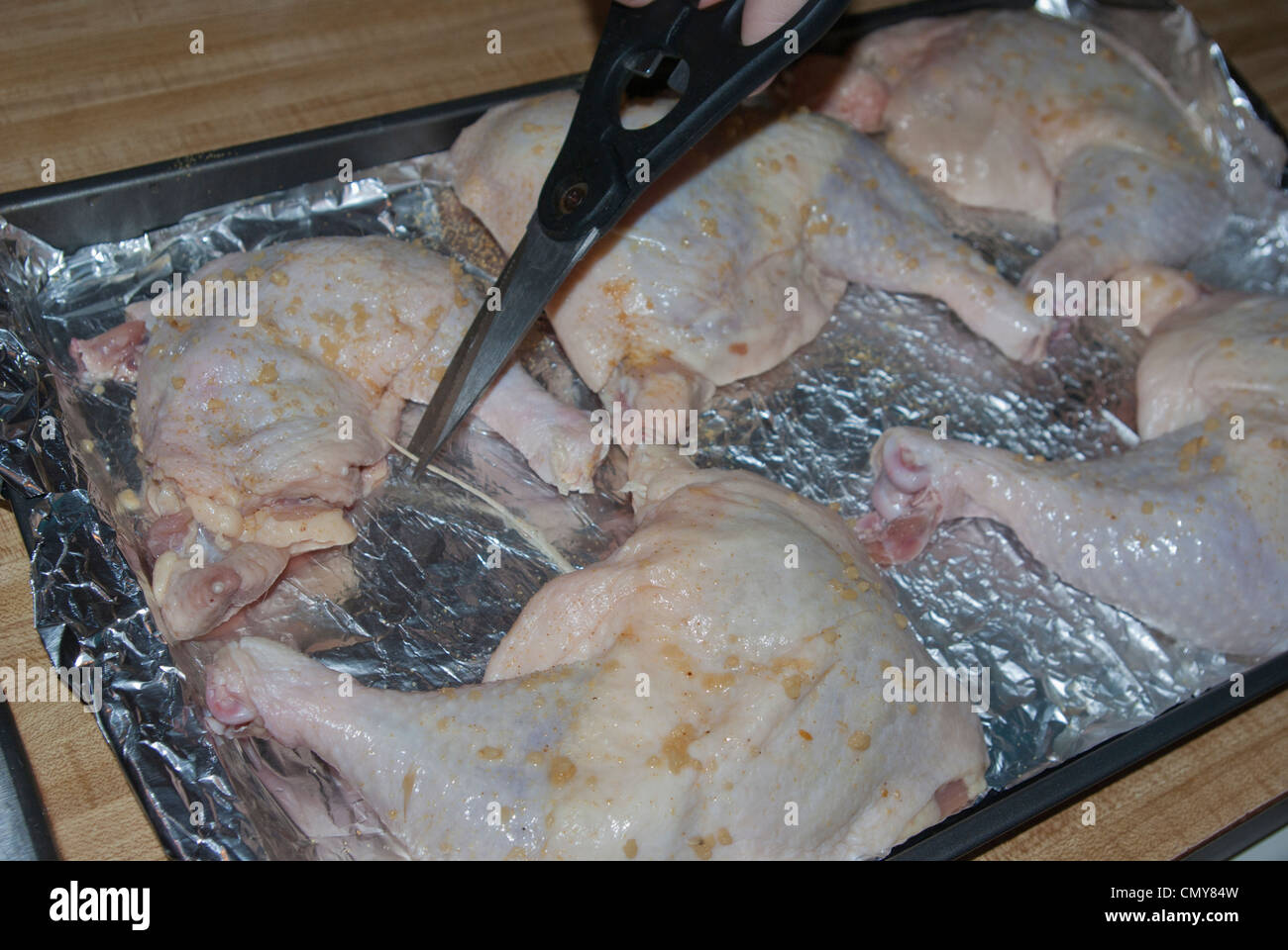 Raw Chicken with Shears Stock Photo