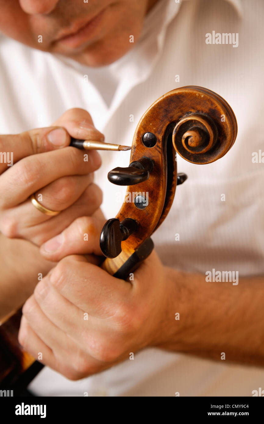 Germany, Upper Bavaria, Schaeftlarn, Violin maker making violin, close up Stock Photo