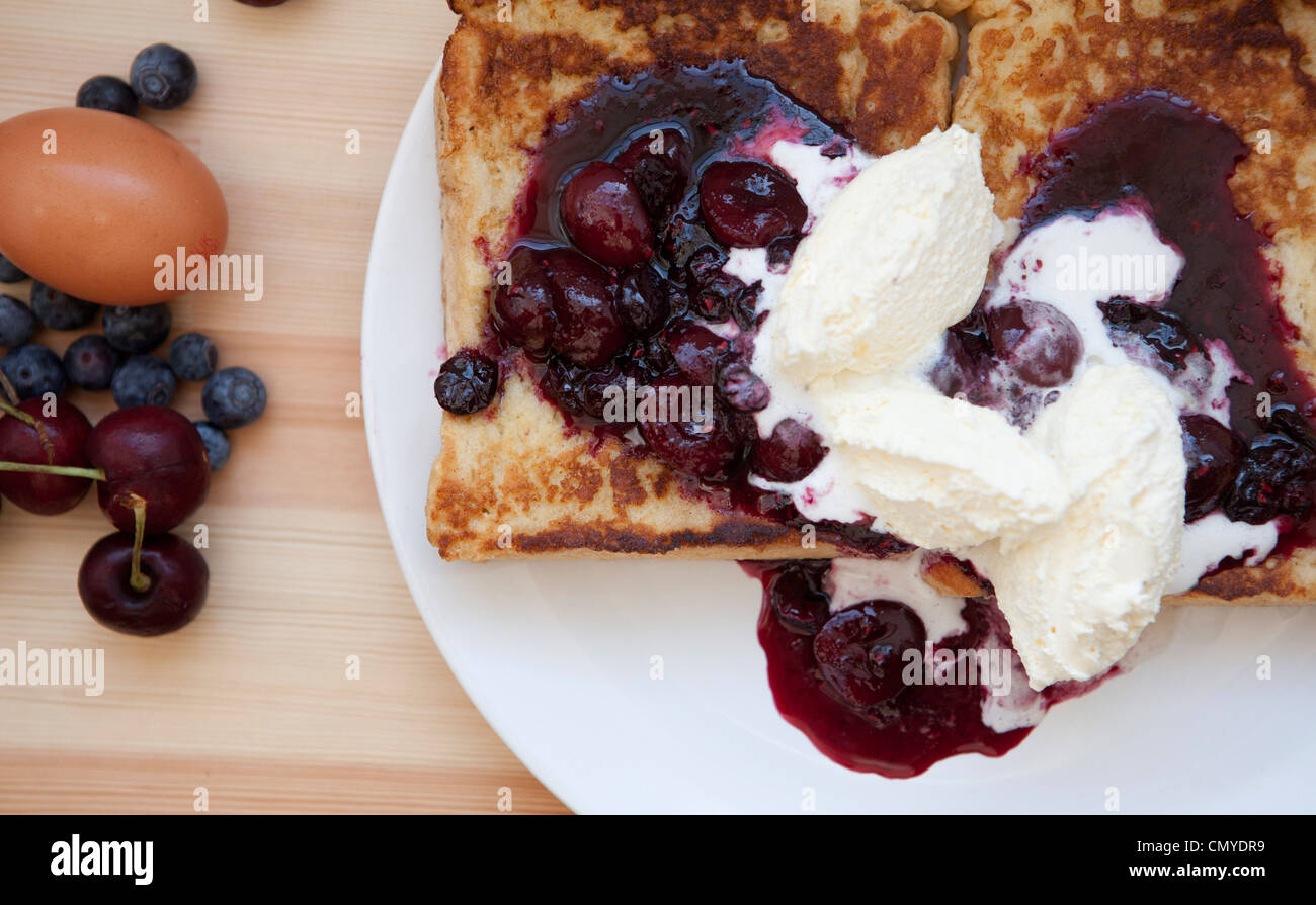 French toast with mixed berry compote and whipped double cream