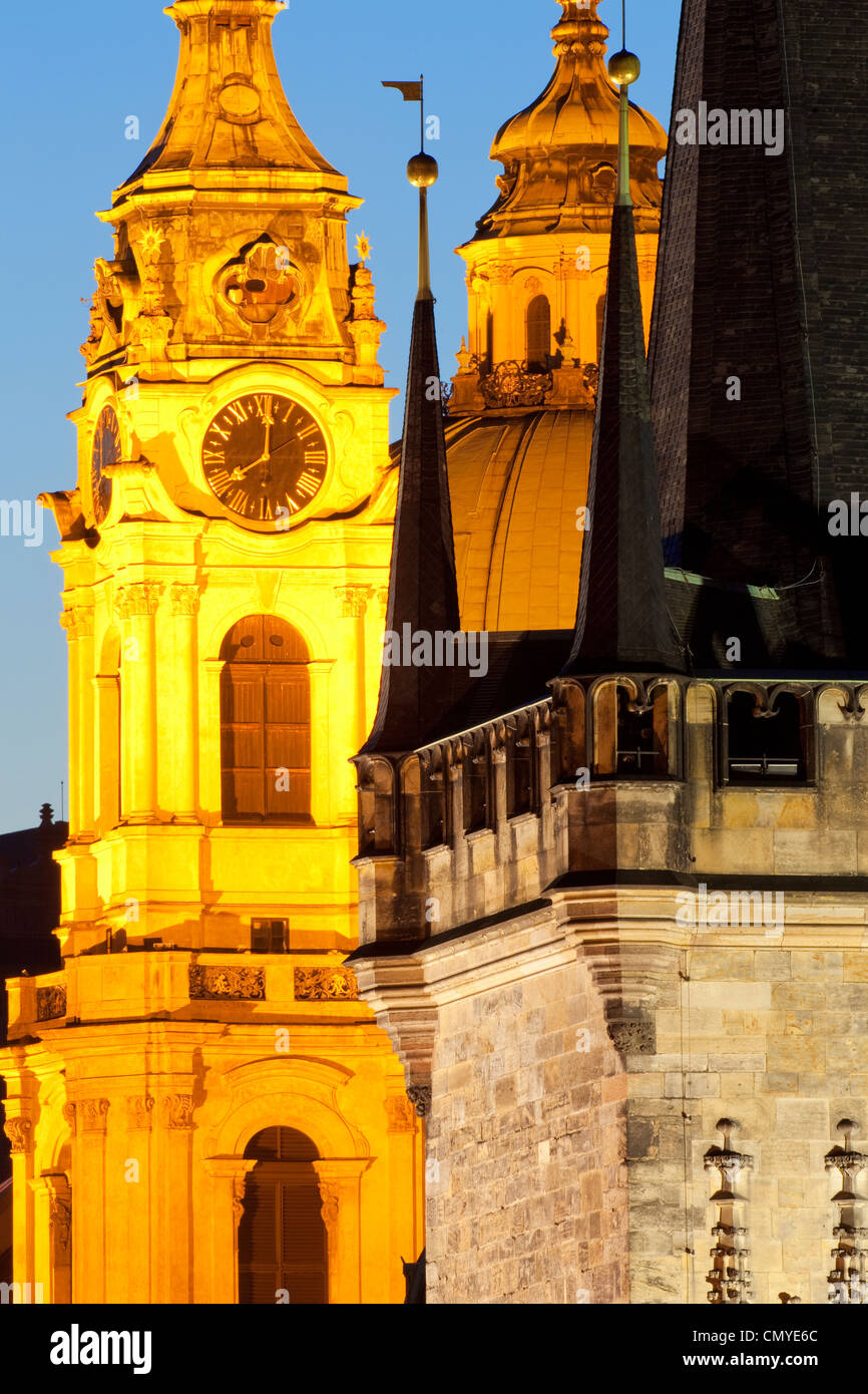 prague - different architectural styles-st. nicolas church and charles bridge tower Stock Photo