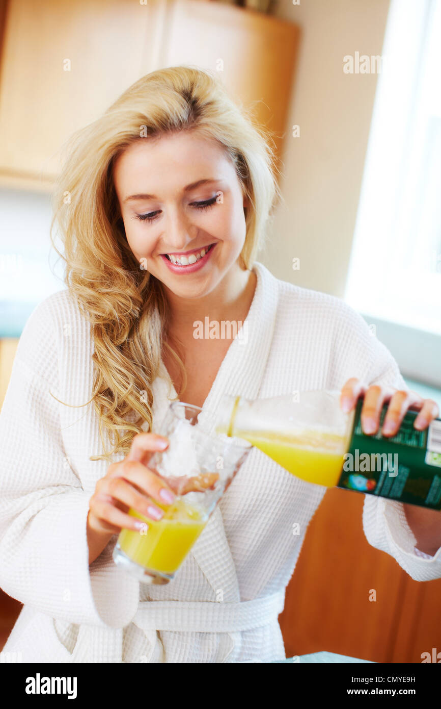 Girl drinking orange juice Stock Photo Alamy