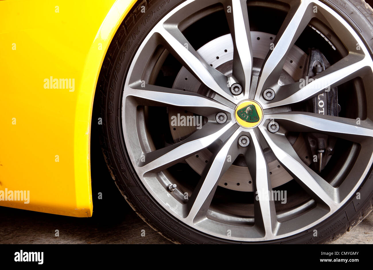 Yellow Lotus Evora sports car wheel in England, UK. The fast two seater supercar is made in Norfolk. Stock Photo