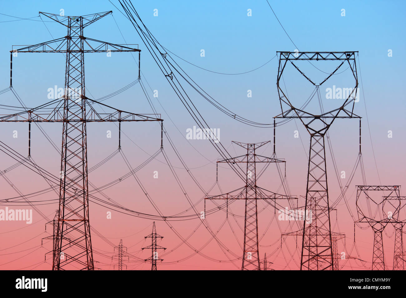 Power lines on evening sky Stock Photo