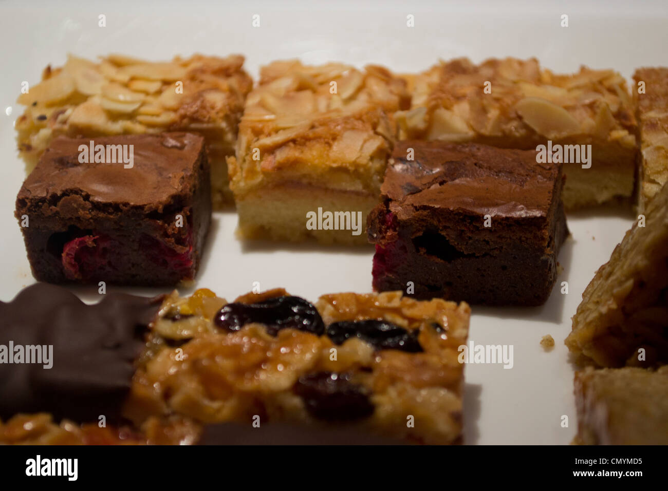 A plate of home-made flapjacks and other treats. Stock Photo