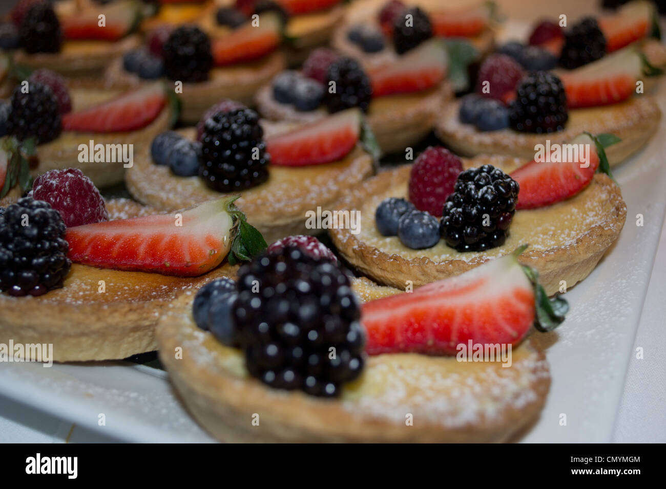 A selection of freshly-made fruit tartlets Stock Photo