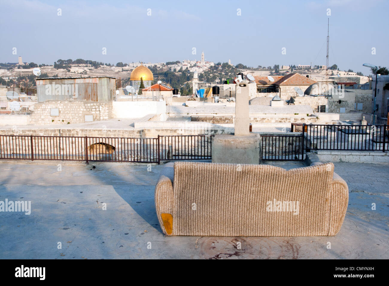 Couch atop the passages of the old city of Jerusalem overlooking the Temple Mount and Mount of Olives. Stock Photo