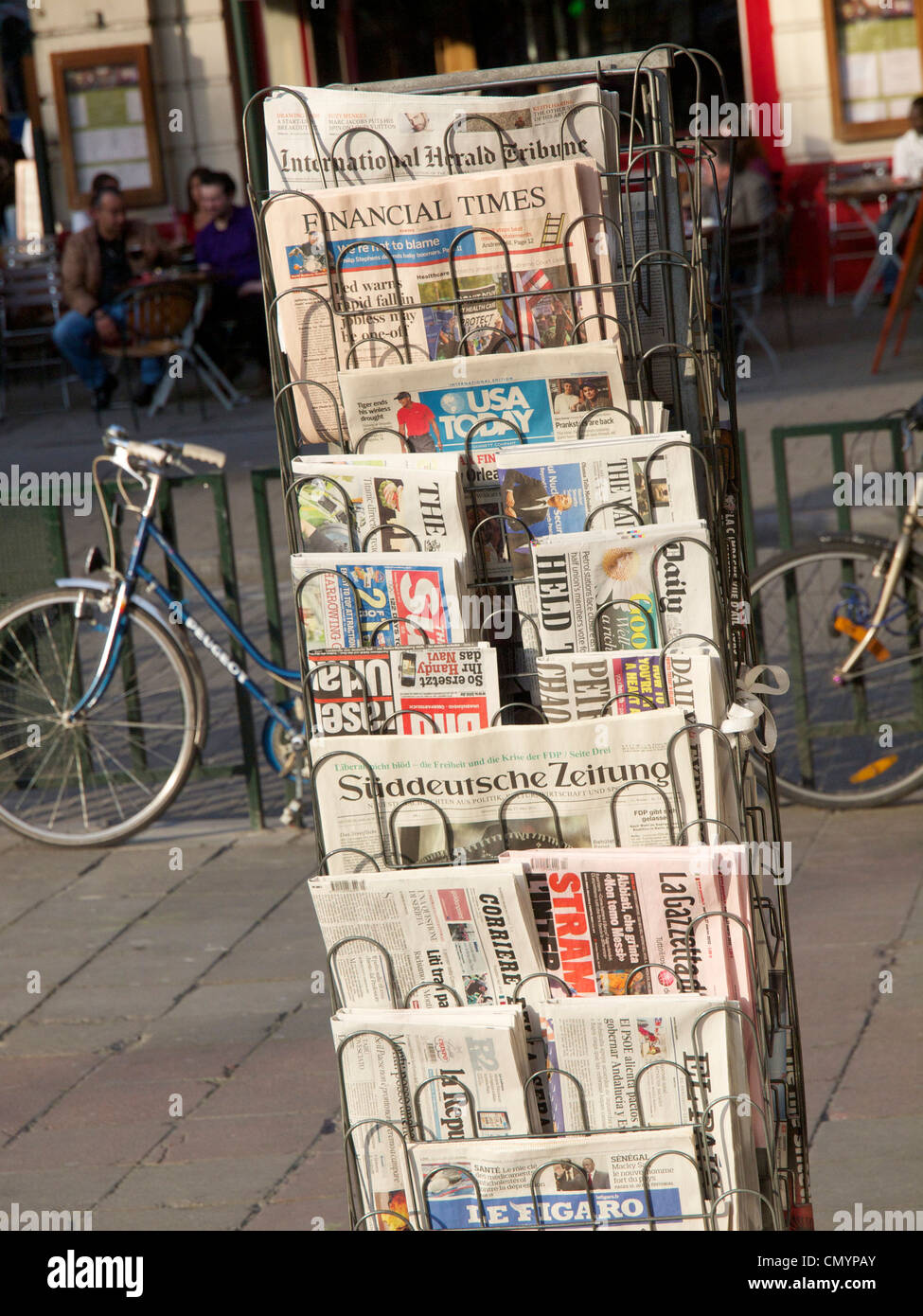 Various European newspapers in rack in front of a newsstand in Brussels, Belgium Stock Photo