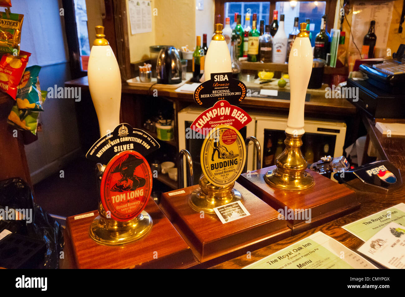 Beer pumps of Budding (pale ale) and Tom Long (amber bitter) in pub, Gloucestershire, UK Stock Photo