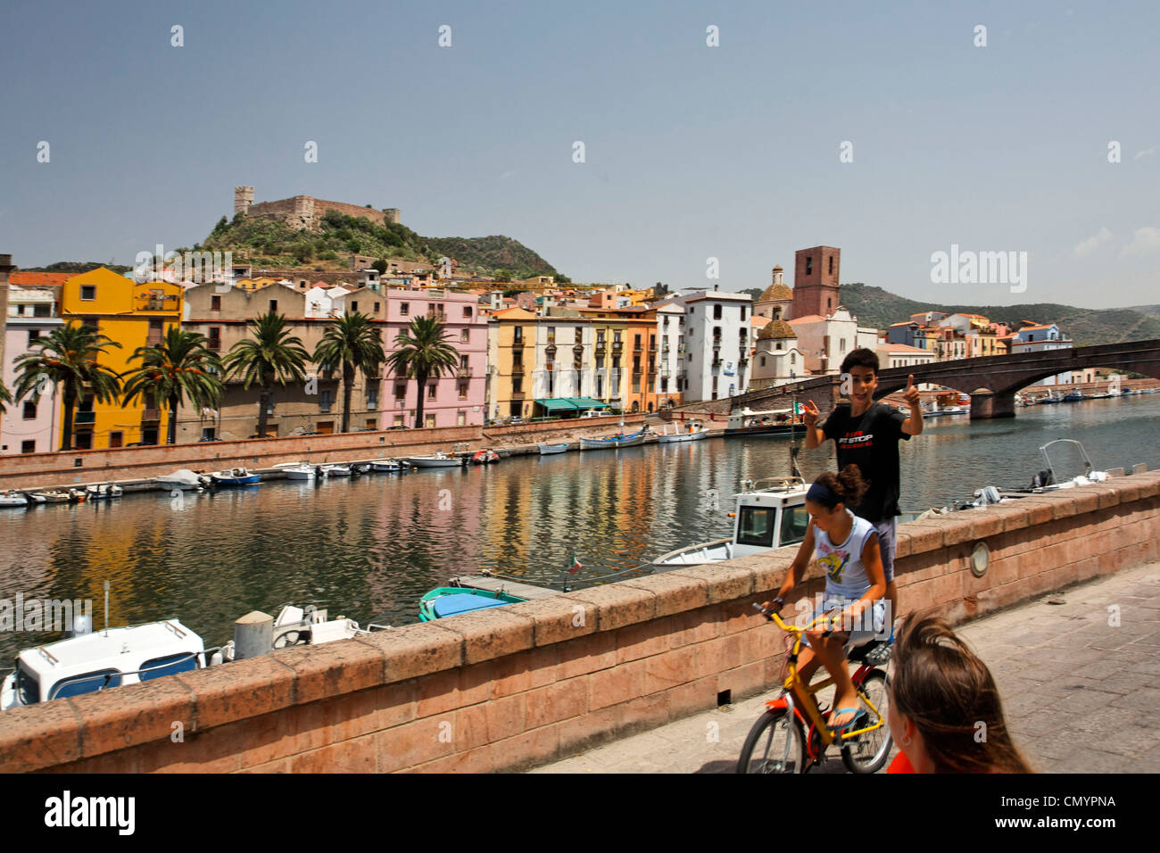 Italy Sardinia Bosa west coast canal, children on bicycle Stock Photo