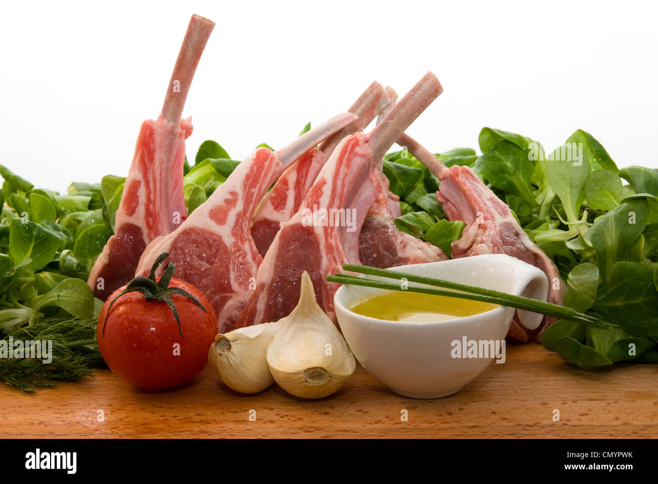 photo of some Racks of lamb with ingredients, ready for cooking Stock Photo Alamy