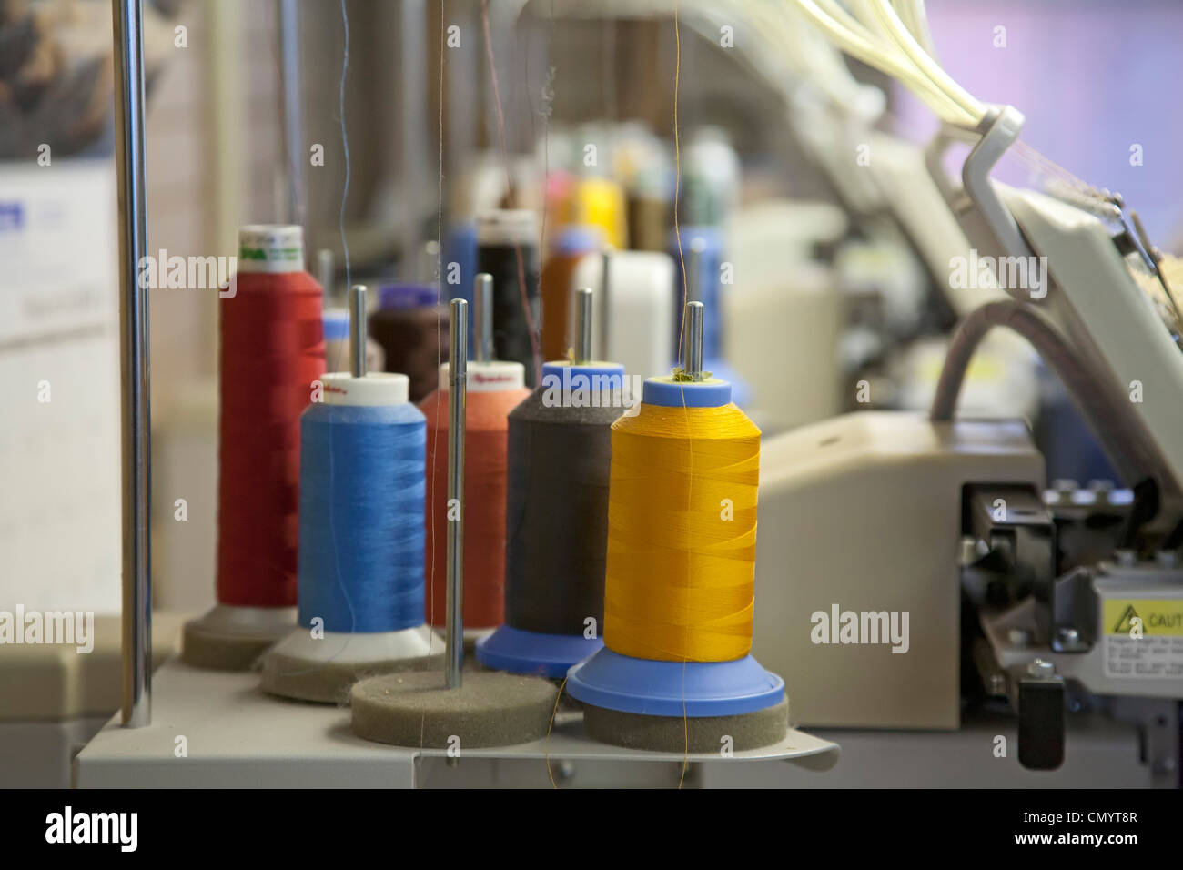 Thread on an embroidery machine at the Amana Woolen Mill. Stock Photo