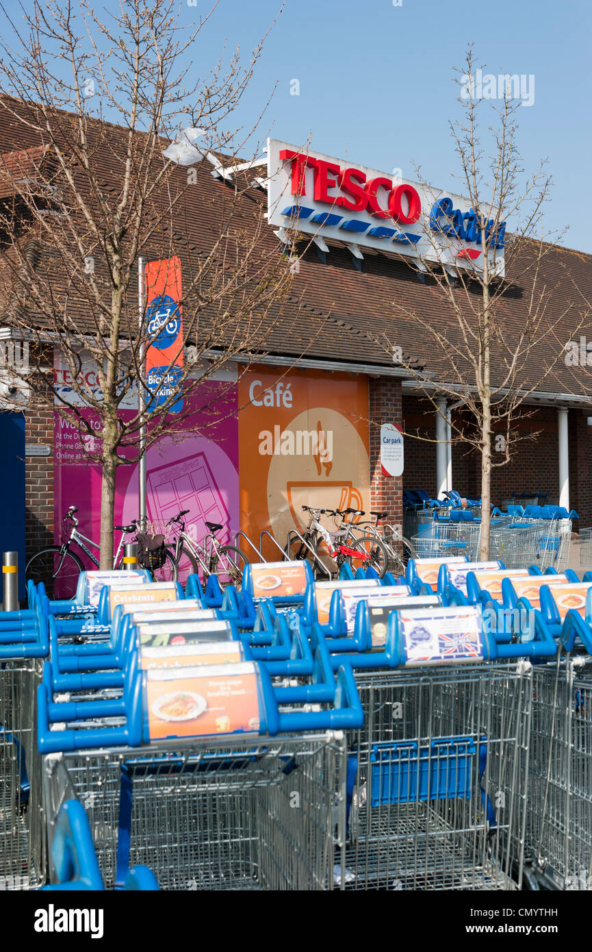 Supermarket trolleys in a trolley bay at the Tesco Extra store