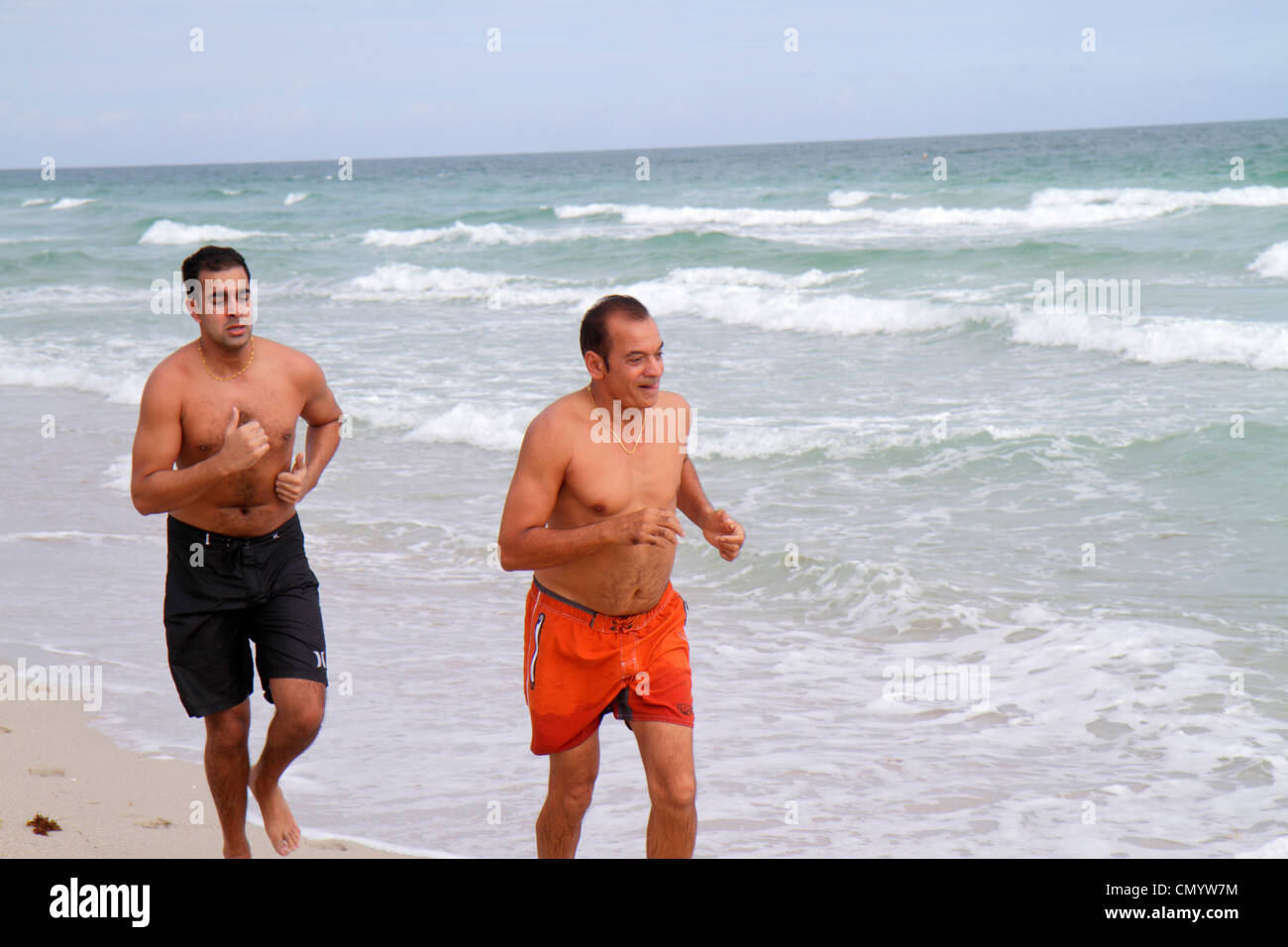 Miami Beach Florida,Atlantic Ocean water shore,surf,waves,water,man men