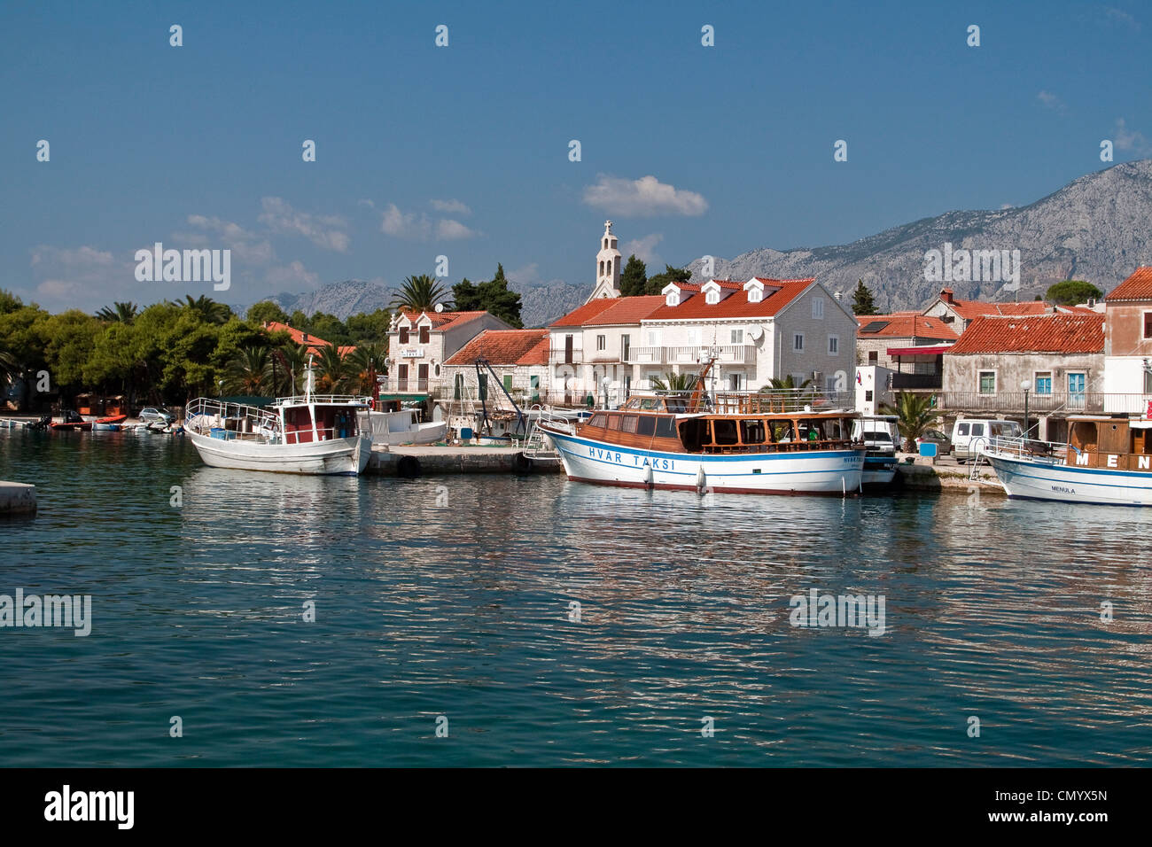 Little harbour of Stari Grad with church, Hvar, Croatia Stock Photo