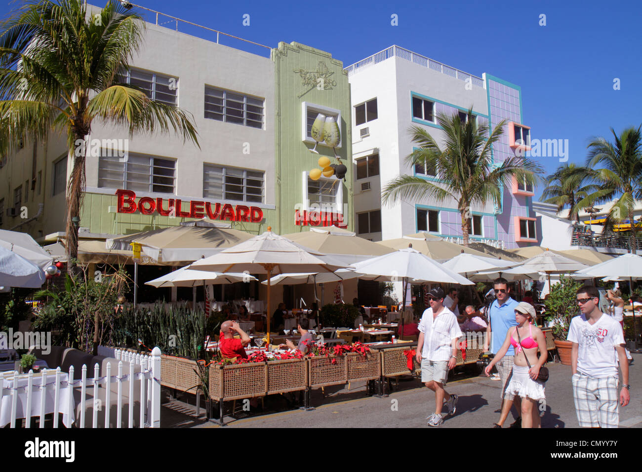 Miami Beach Florida,Ocean Drive,Art Deco Historic District,Boulevard,hotel,man men male,woman female women,al fresco sidewalk outside tables,dining,re Stock Photo