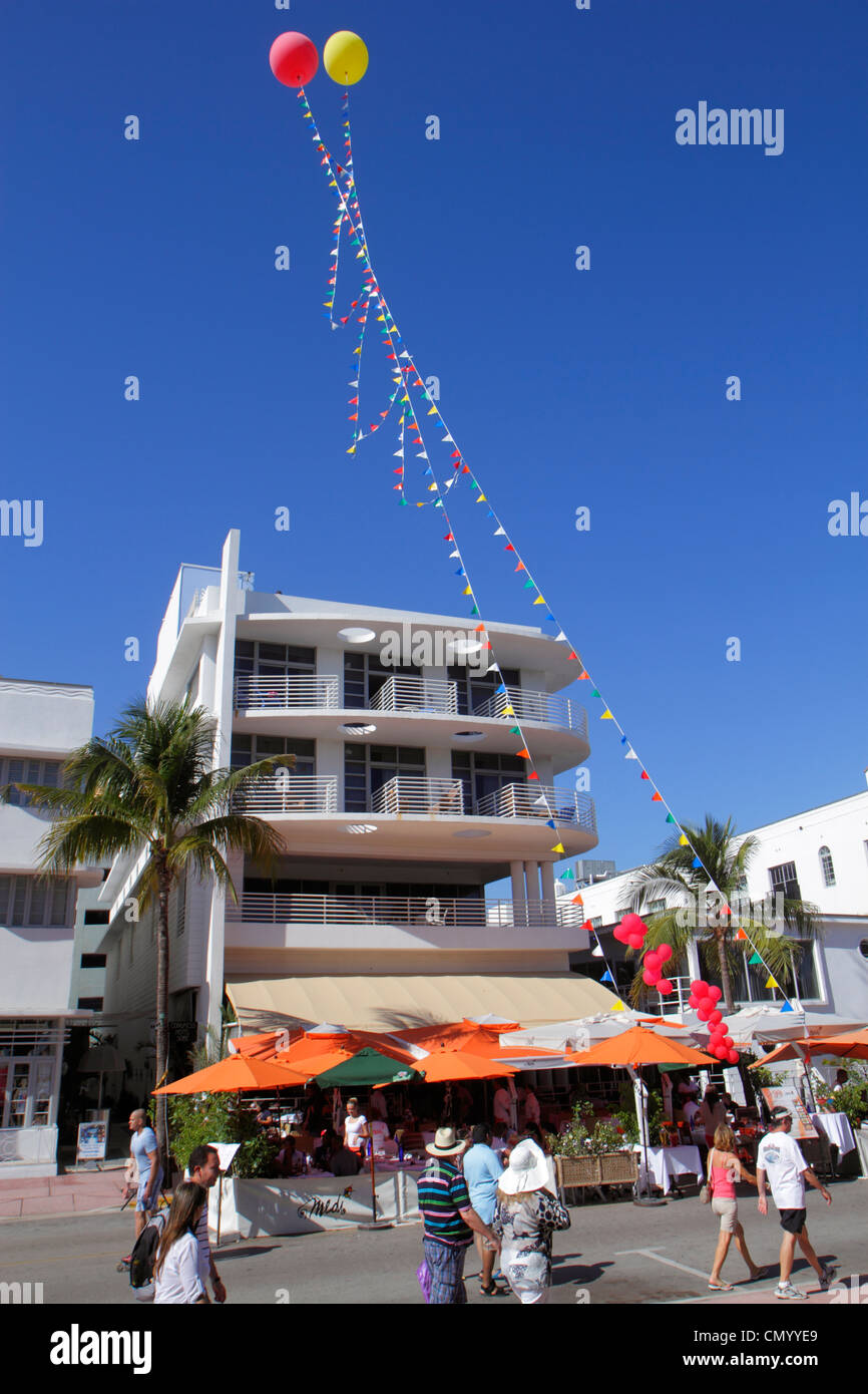 Miami Beach Florida,Ocean Drive,hotel hotels lodging inn motel motels,al fresco sidewalk outside outdoors tables,dining,umbrellas,balloons,visitors tr Stock Photo