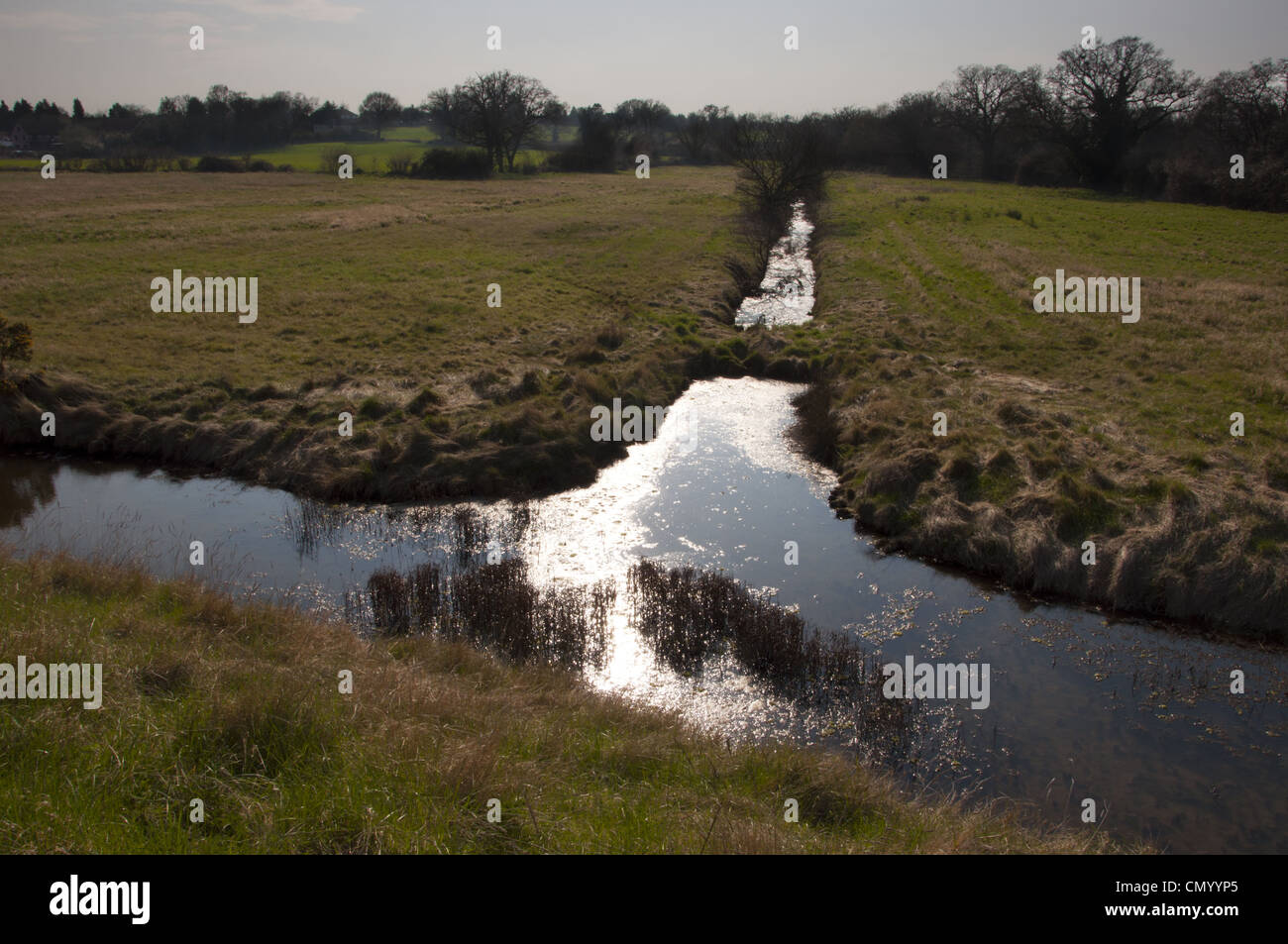 rural drainage ditch in agricultural field Stock Photo