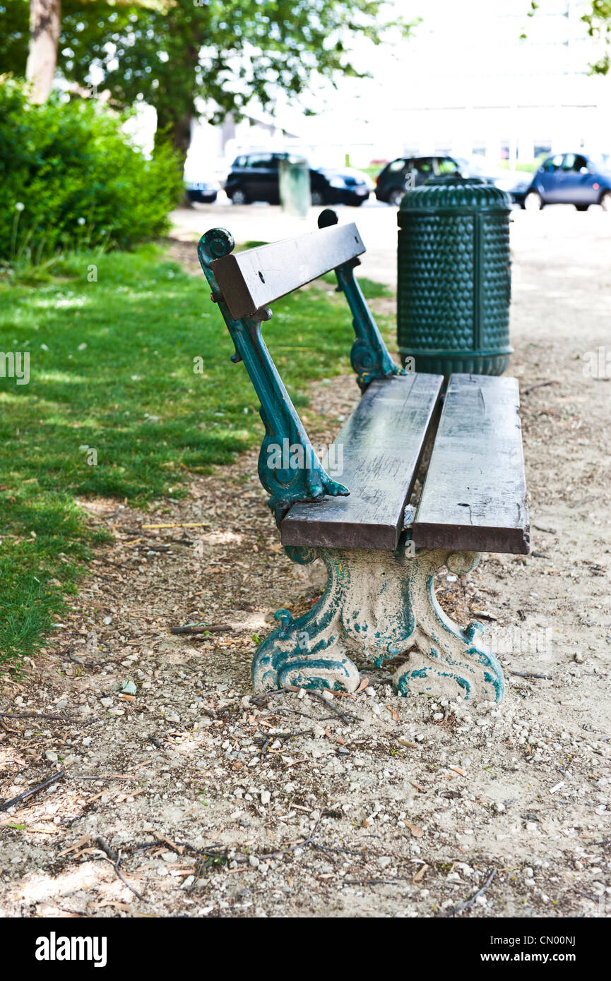 Side view of a park bench along the sidewalks in Brussels, Belgium. Stock Photo