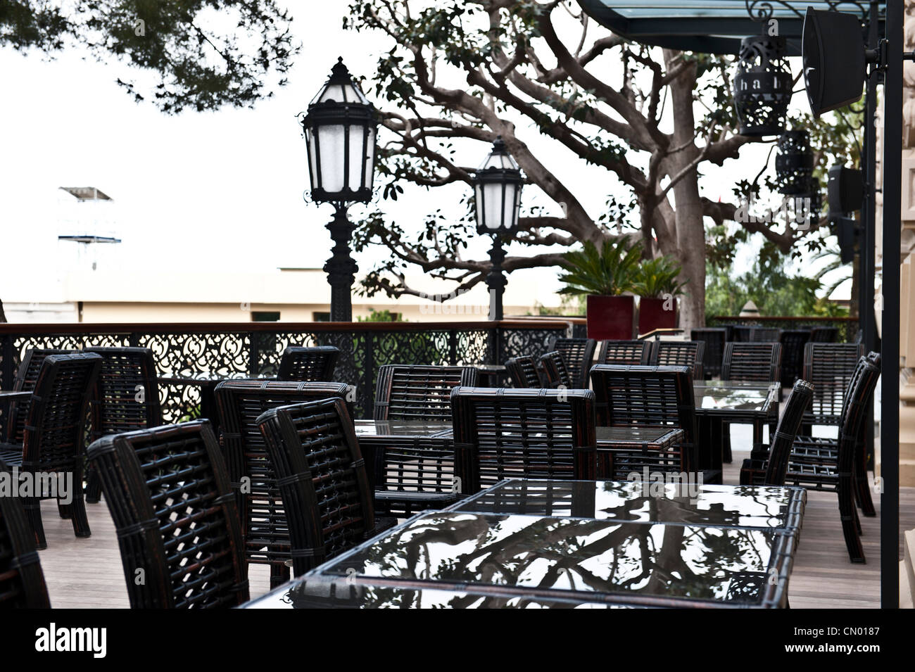 A glass table set in Cannes, France. Stock Photo