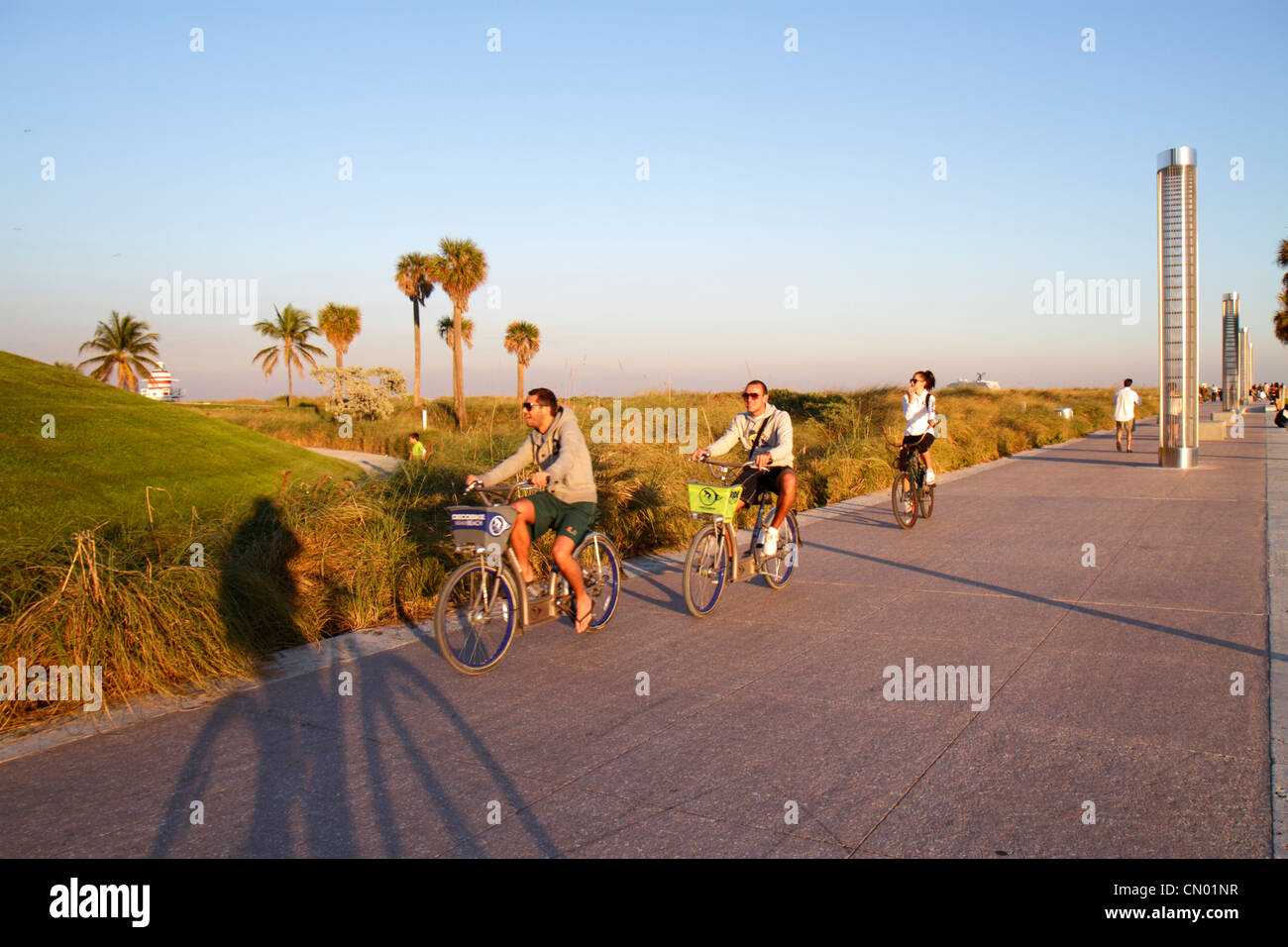 Miami Beach Florida,South Pointe Park,Point,turtle light towers,DecoBike Citi Bike CitiBike rental bikes,man men male,woman female women,FL120114010 Stock Photo