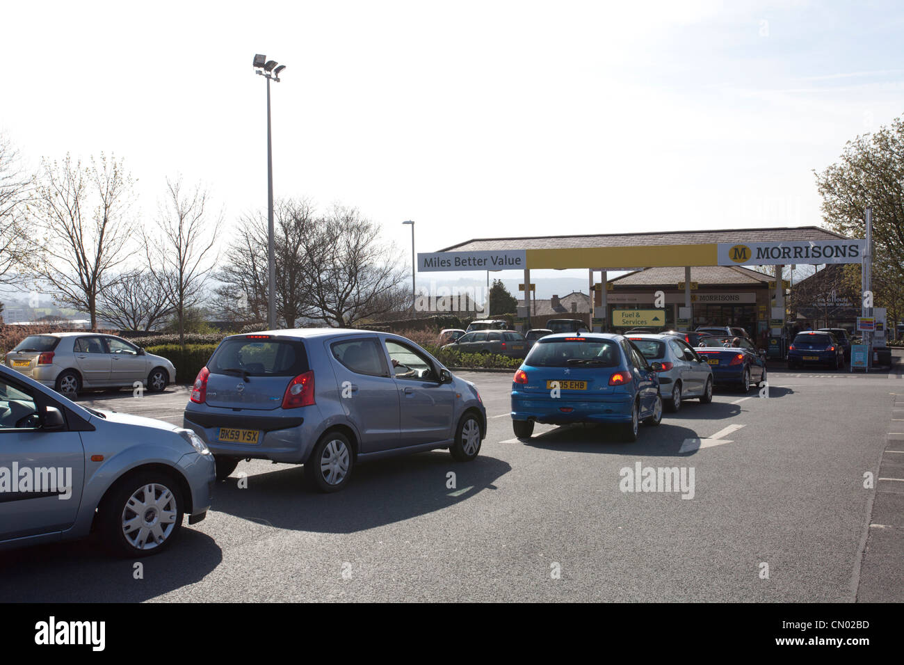 Cars queue to buy fuel after the Unite union discusses the possibility of strikes over  pay, working conditions and safety. Stock Photo