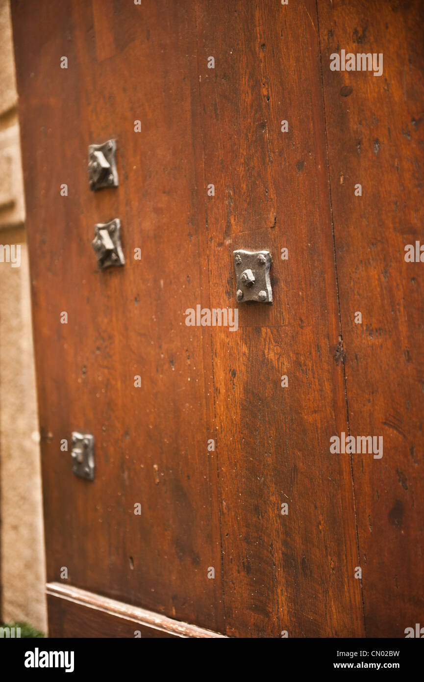 A bright shot of slightly opened wood door. Stock Photo