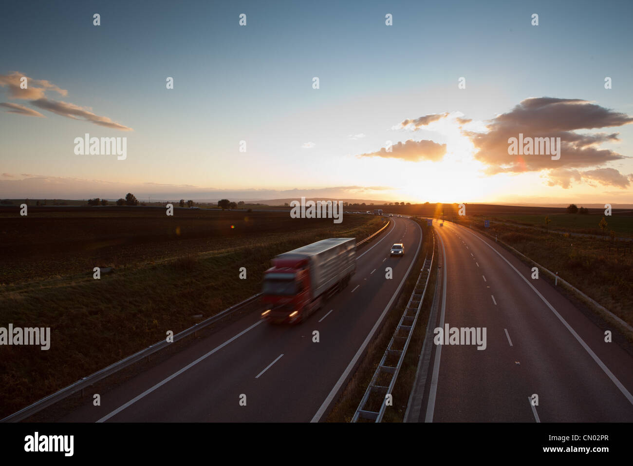 highway traffic - motion blurred truck on a highway/motorway/speedway ...