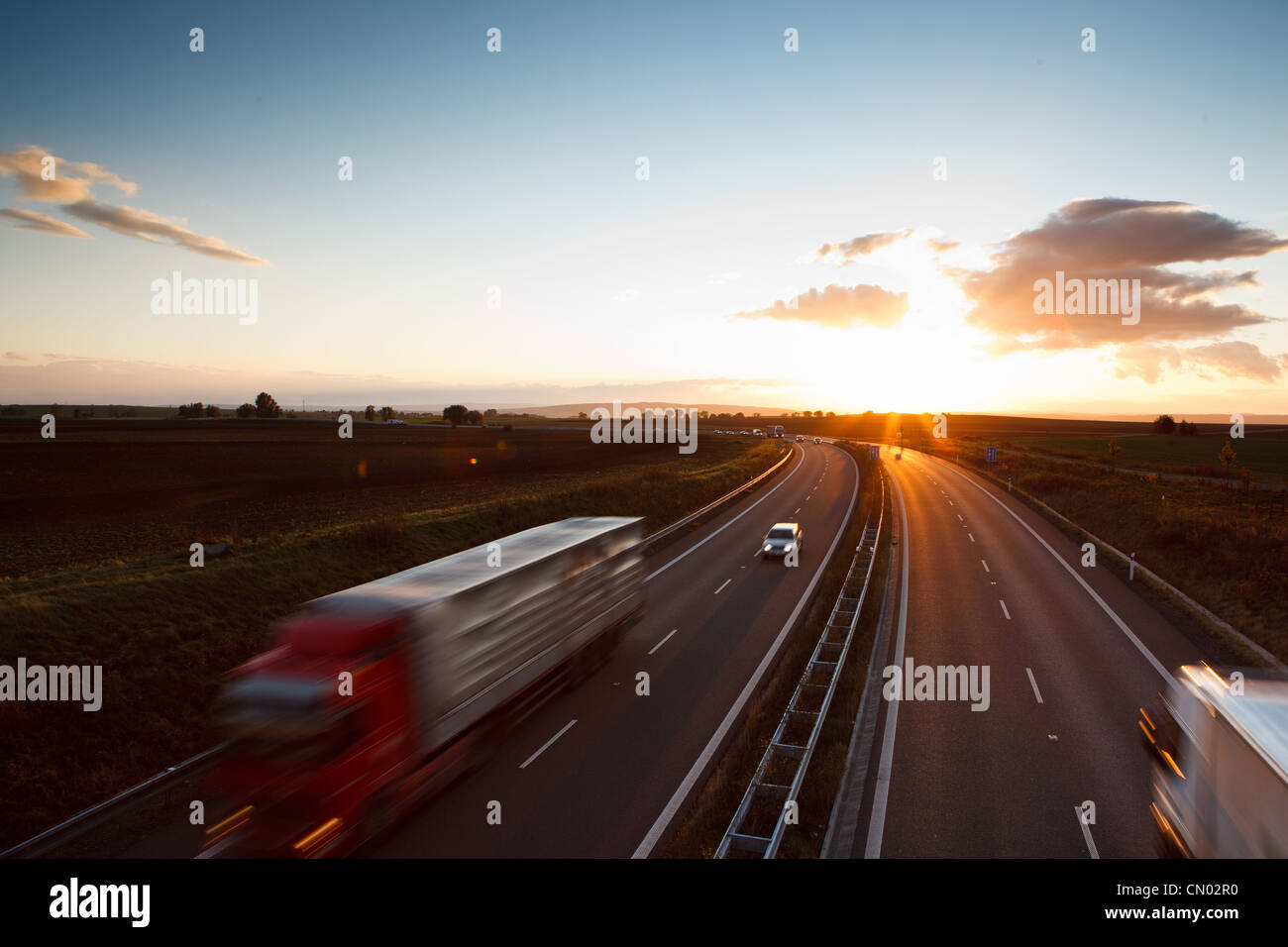 highway traffic - motion blurred truck on a highway/motorway/speedway ...