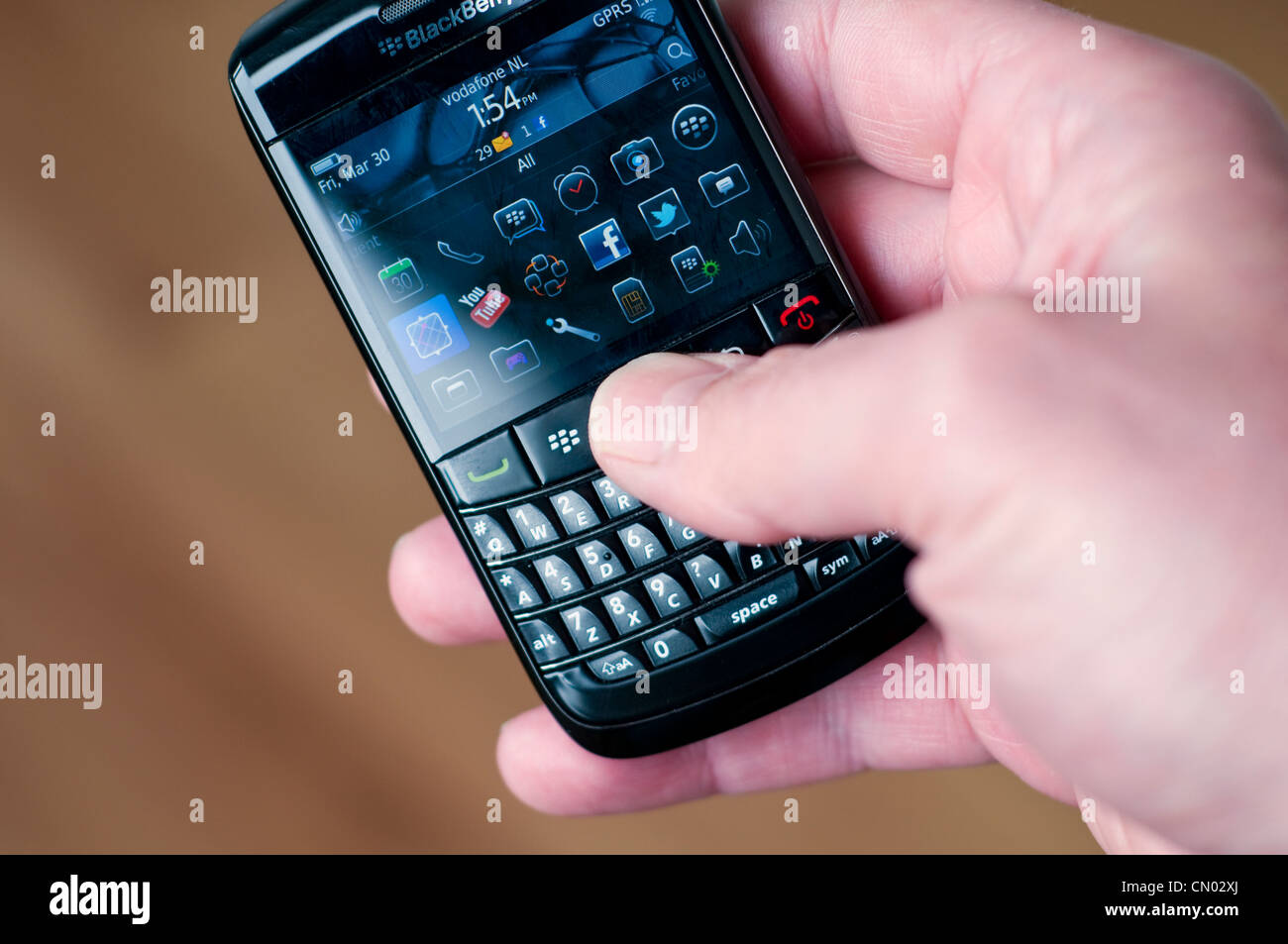 Someone using a BlackBerry mobile phone Stock Photo