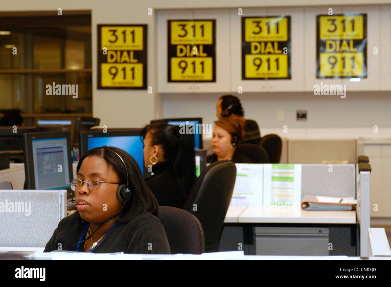 Operators take calls in the New York 311 Calling Center on January 10, 2004. (© Frances M. Roberts) Stock Photo