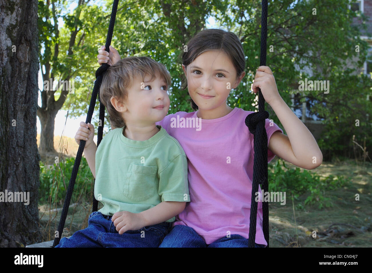 Brother and Sister Playing on Swing, Uxbridge, Ontario Stock Photo - Alamy