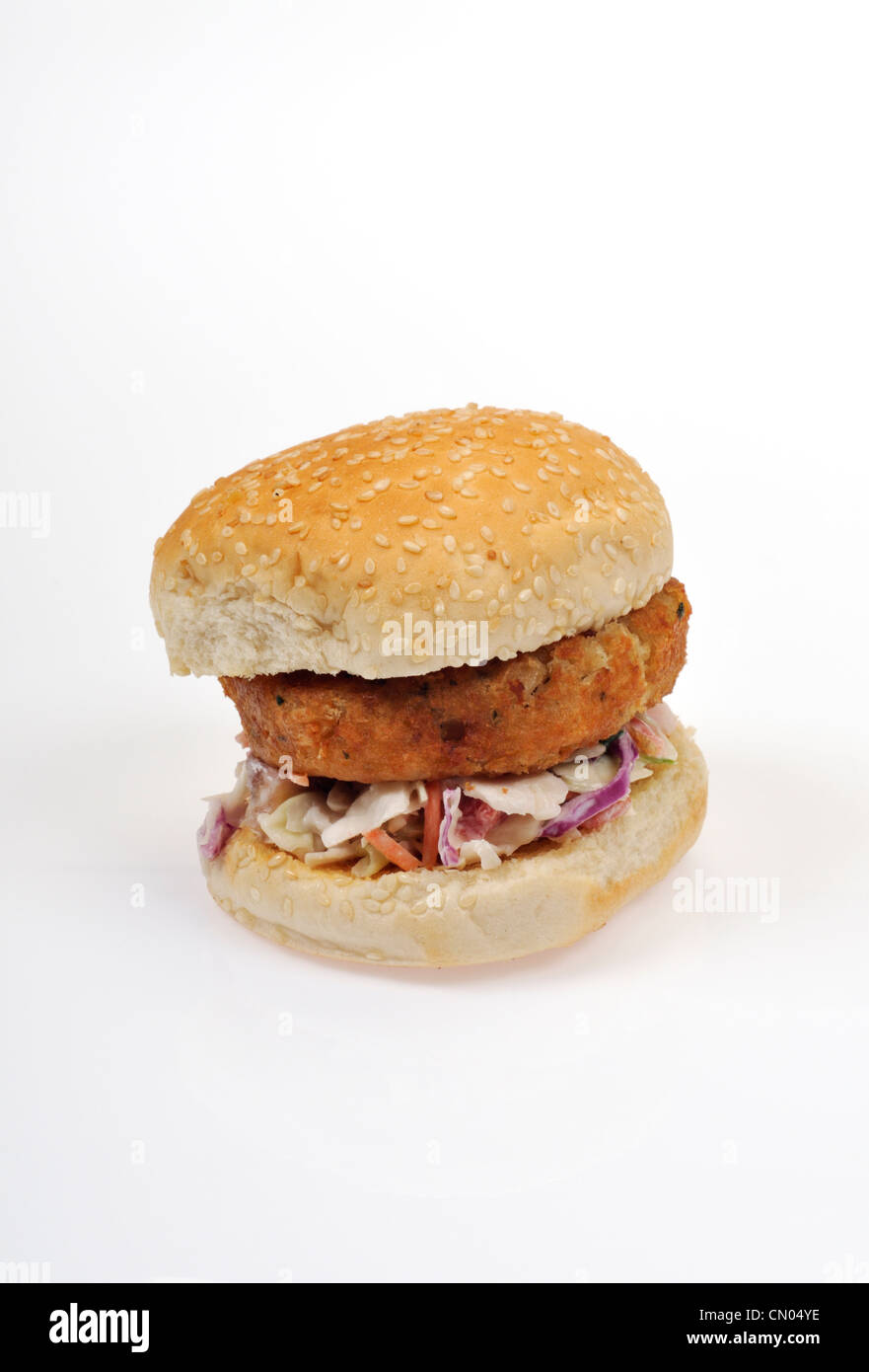 Cod fish cake sandwich in a seeded roll on cole slaw Stock Photo Alamy