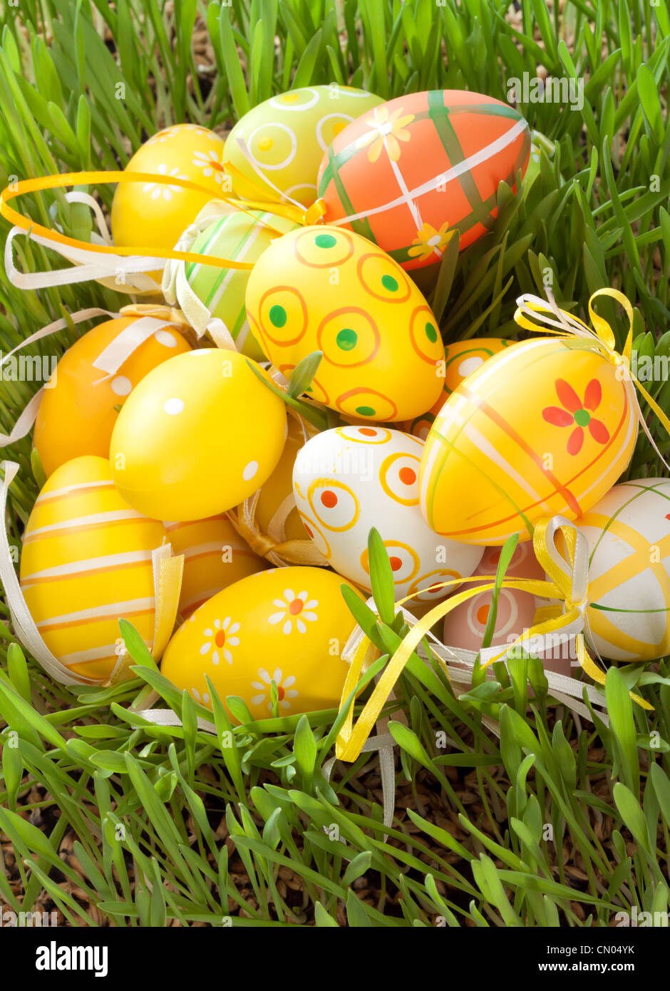 Easter eggs hidden in the green grass Stock Photo - Alamy