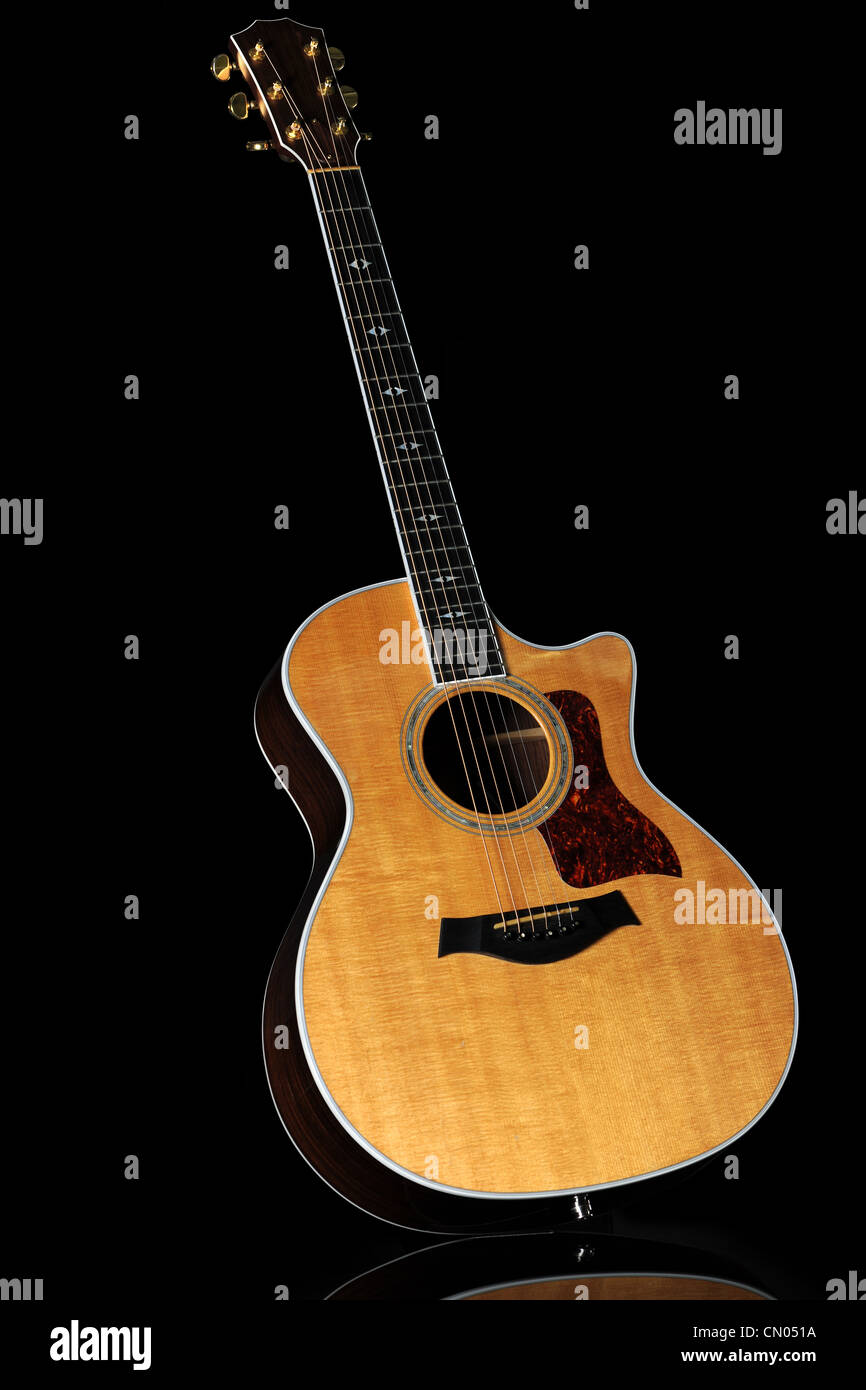 Wooden acoustic guitar over black background - With clipping path Stock Photo