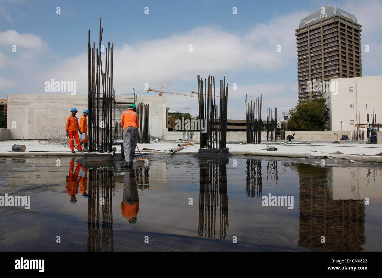 Construction of booming businesses in South Africa's richest area Sandton creates employment for many. South Africa Stock Photo