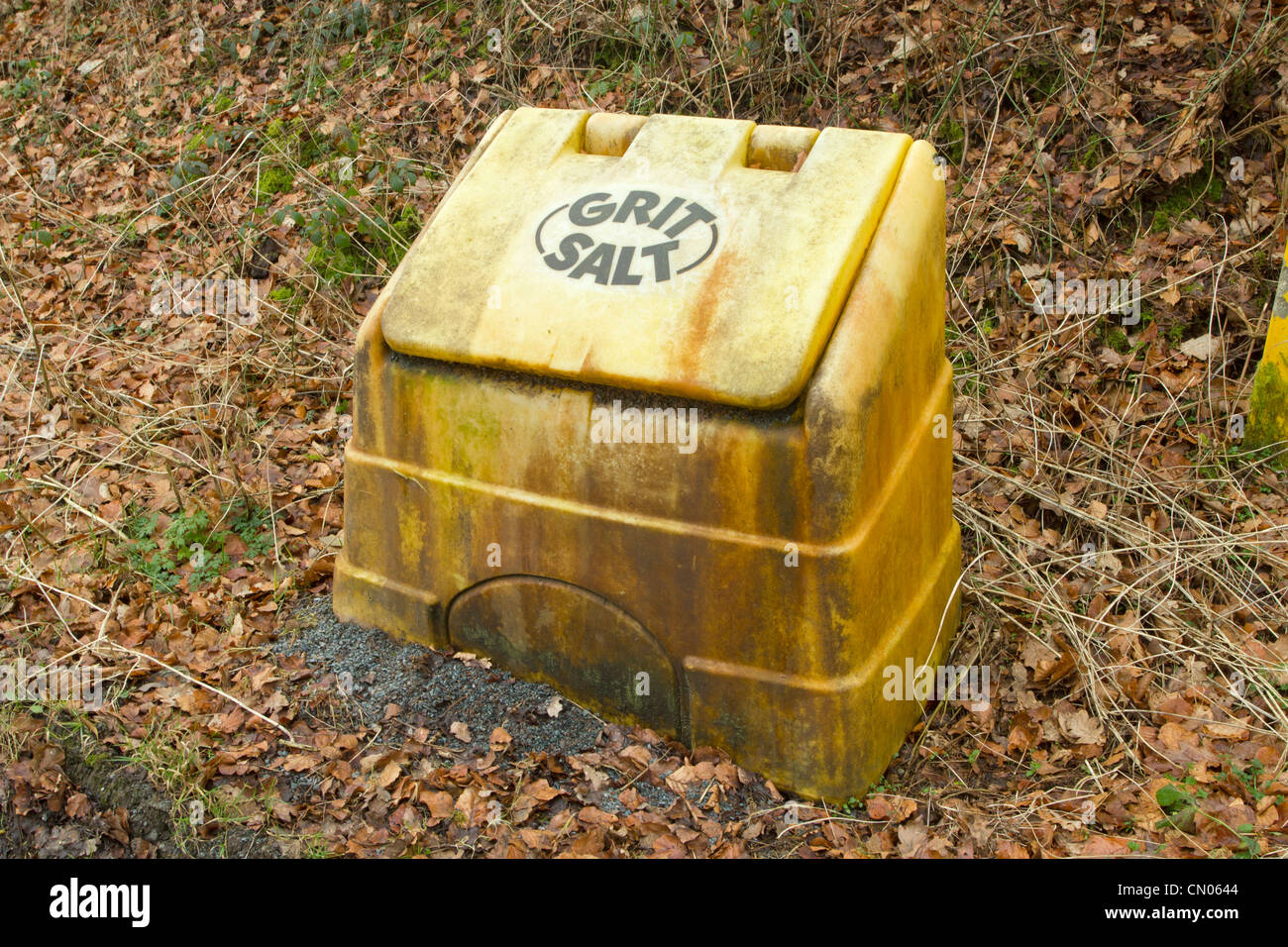 Yellow British grit salt roadside container for gritting in the winter. Stock Photo