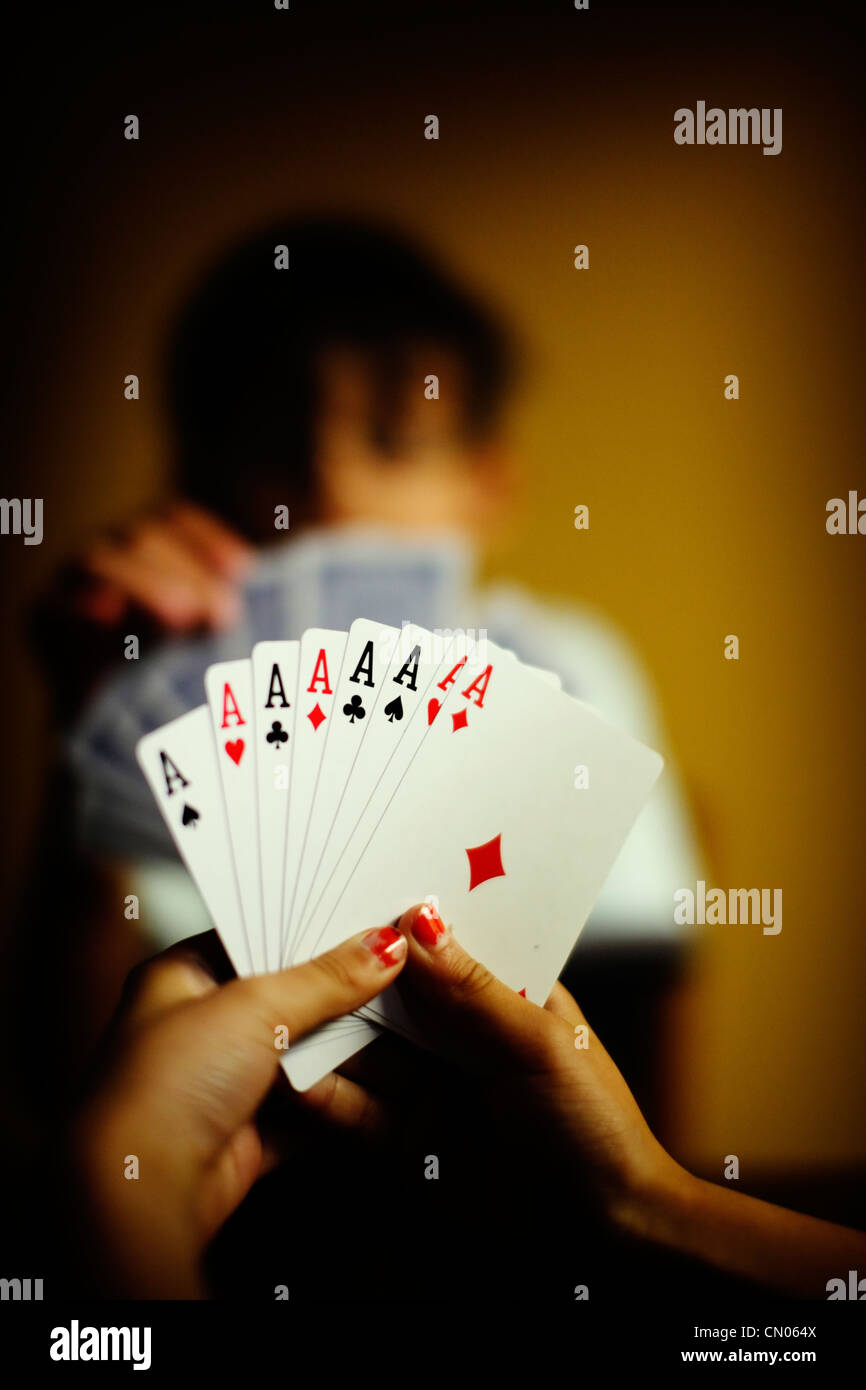 Eight Aces: children play game of cards Stock Photo