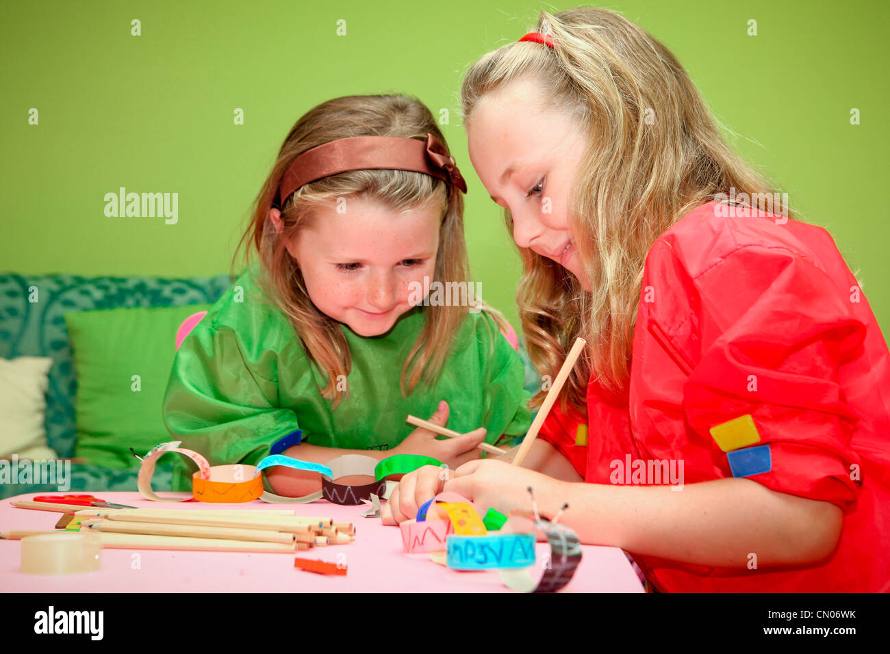 happy smiling children playing drawing and making craft in class at kindergarten school Stock Photo