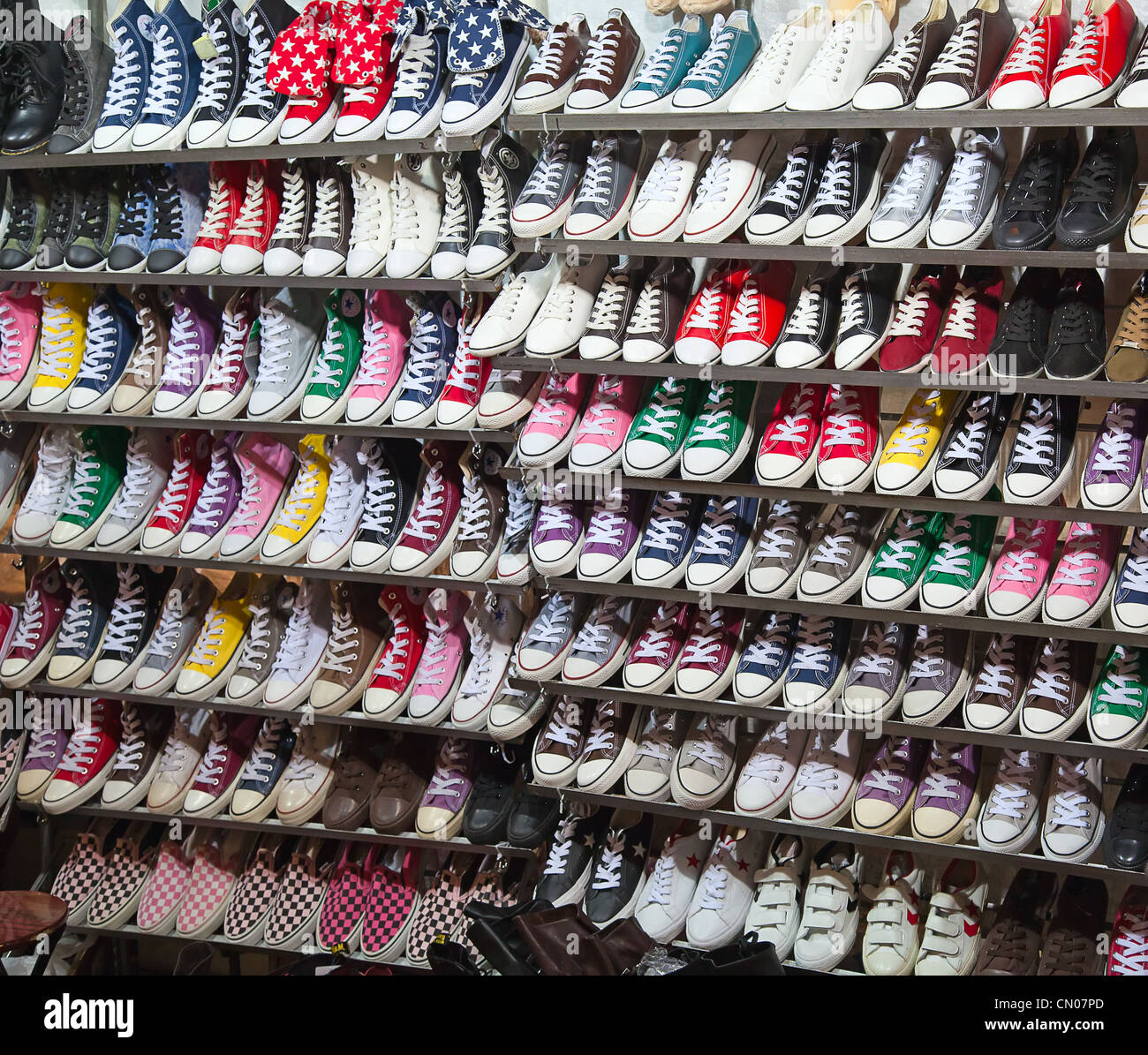 lots of sneaker shoes on sale Stock Photo - Alamy