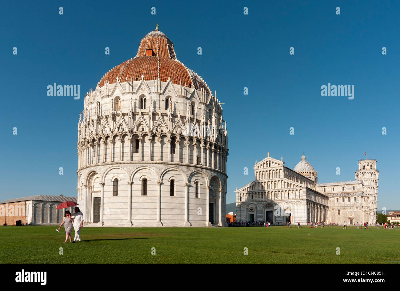 Baptistry of St John (Battistero di San Giovanni) and Duomo (Cathedral) at Piazza dei Miracoli (Square of Miracles), Pisa, Italy Stock Photo