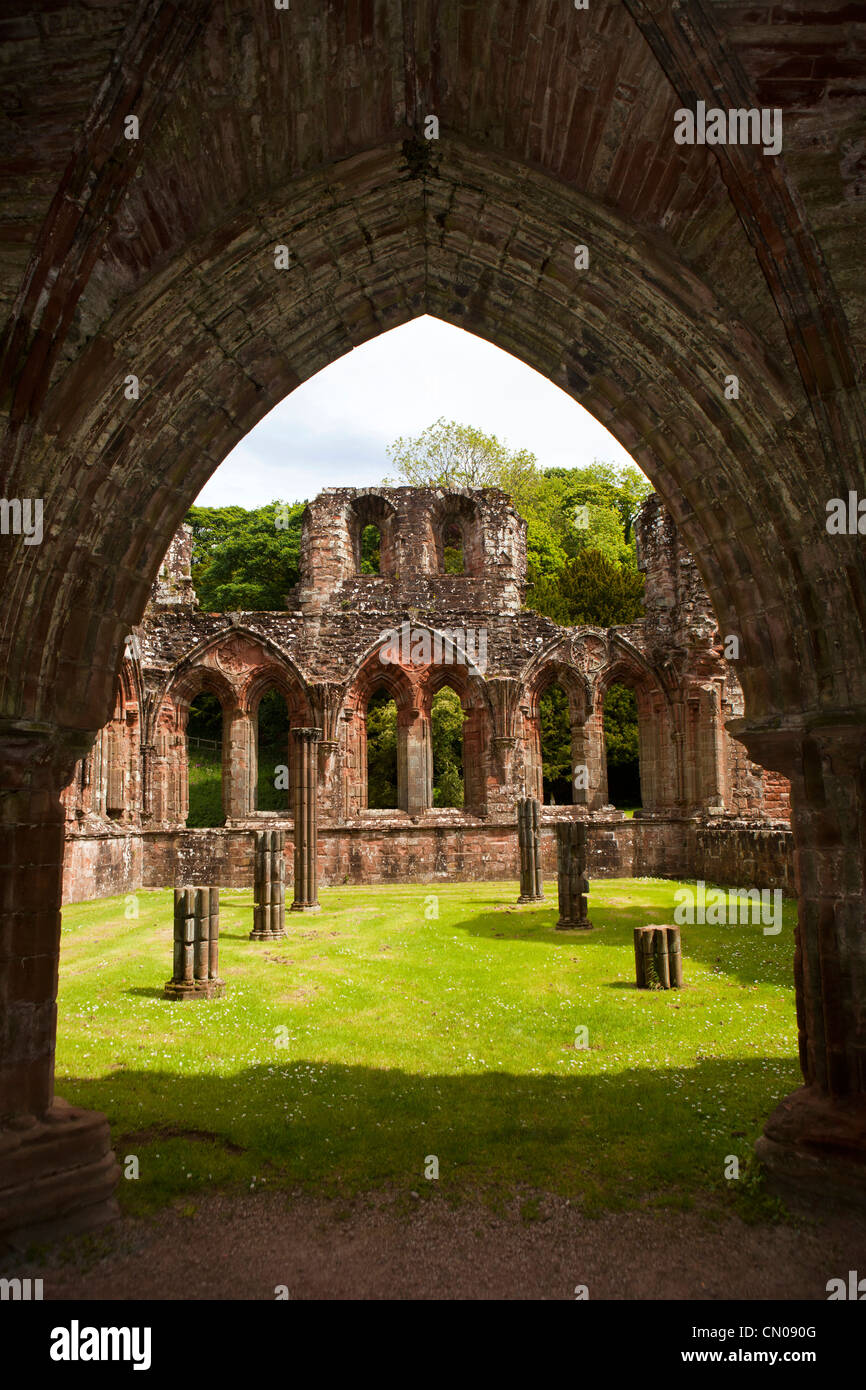 UK, Cumbria, Barrow in Furness, Furness Abbey, ruins of former Cistercian Monastery view through arched doorway Stock Photo