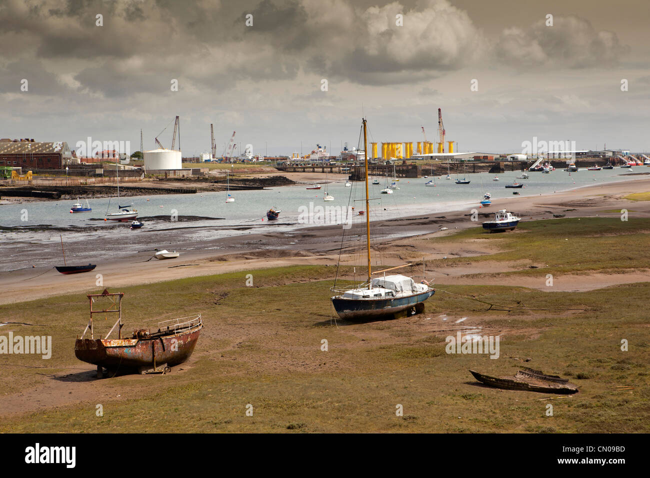 UK, Cumbria, Barrow in Furness, boats moored in Walney Channel at low tide Stock Photo