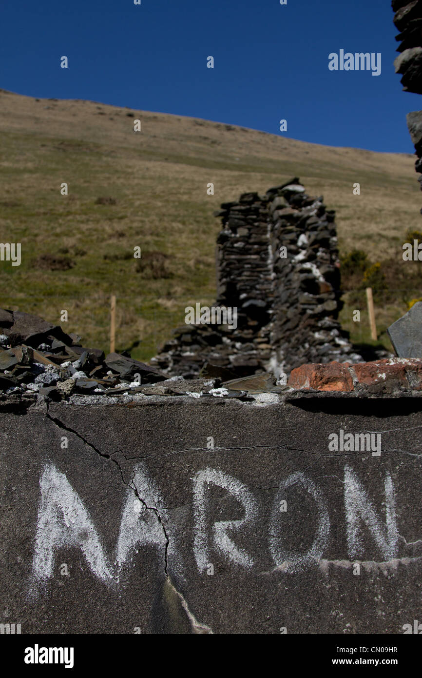 Aaron graffito on ruined industrial barracks Cwmystwyth lead and silver mine Stock Photo